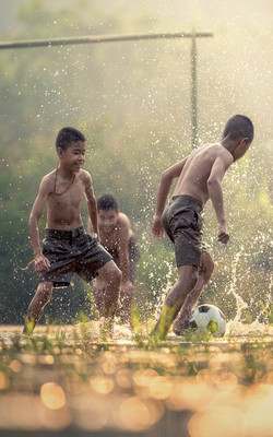 Asian Kids Playing Soccer Mobile Wallpaper Preview