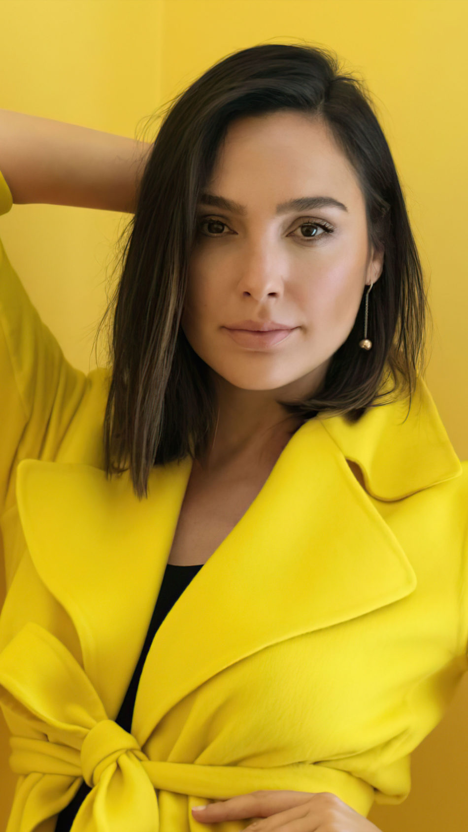 Actress Gal Gadot In Yellow Dress Yellow Background 4K Ultra HD Mobile Wallpaper