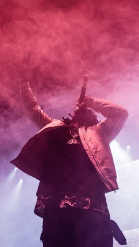 Travis Scott On Stage Performing Live Singing 4K Ultra HD Mobile Wallpaper