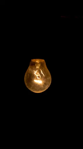 Traditional Light Bulb Dark Background