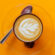 Decorated Coffee Cup Orange Background 4K Ultra HD Mobile Wallpaper